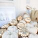 Since the wedding was held in October, Kendal wanted to incorporate some fall themed decor. She had about 60 miniature pumpkins which she painted shiny gold and used those on the welcome table, guest book table and bar. It was a great way to tie the season into the color palette.