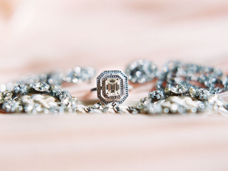 Alex designed Jamie’s art deco engagement ring to look "different" and unique to his bride. Jamie says people comment on her emerald-cut double-halo ring and say, "It’s so you!" “I truly feel like it represented the entire theme of our wedding,” says Jamie.