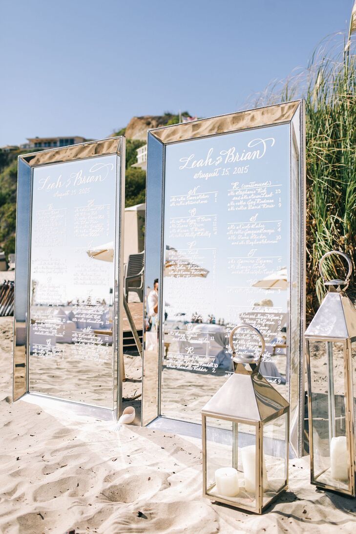 During the cocktail hour, guests lounged on couches in the sand and located their seating assignments on large mirrors, which also displayed the dinner buffet offerings.