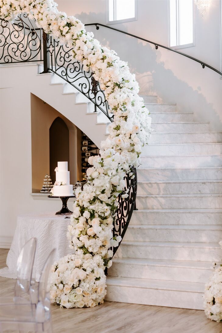 Staircase Decorated With Flowers at Knotting Hill Place in Little Elm, Texas