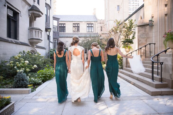 Each of Christina's bridesmaids wore emerald green floor-length Amsale gowns in various styles. To complement the bride's pearl-and-emerald earrings (that belong to her mom), each bridesmaid wore vintage costume jewelry.