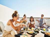Group of friends eating.