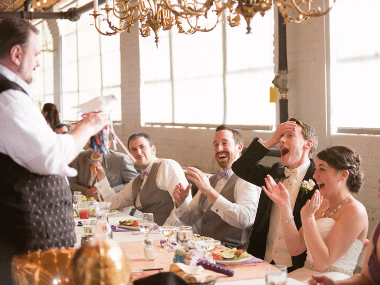 Magician performing for bride and groom as a form of wedding entertainment. 