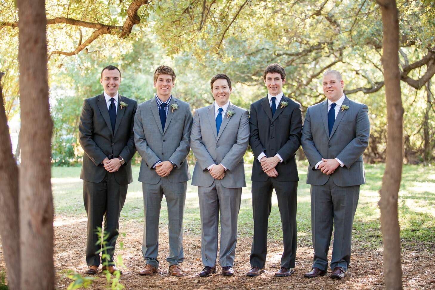 Mismatched Gray Groomsmen Suits With Blue Ties