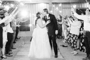 Bride and Groom Kiss During Wedding Reception Exit