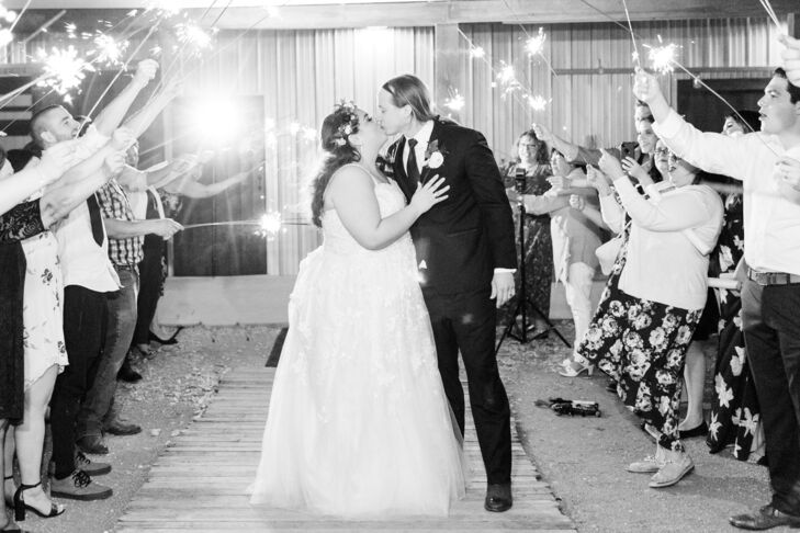 Bride and Groom Kiss During Wedding Reception Exit