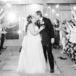 Bride and Groom Kiss During Wedding Reception Exit