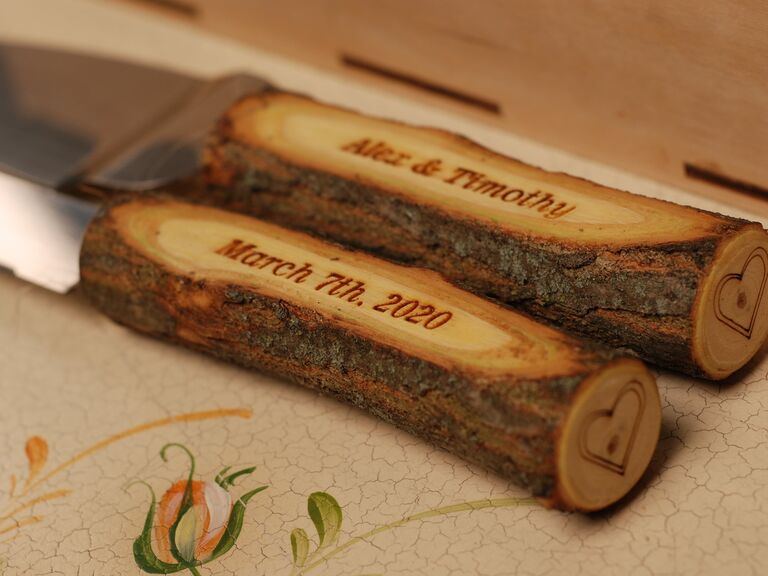 Cake cutting set with custom-engraved wooden handles. 