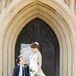Bride in Classic V-Neck Wedding Gown, Groom in Navy Suit With Black Tie, Wheelchair, Historic Church