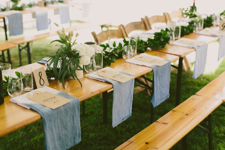 To ensure their decor tied into the evening’s "Hella-Wicked" theme, Erin and Tyler made all the linens for the reception. The couple created dip-dyed napkins in a cool shade of blue and shibori tablecloths with an undeniable West Coast vibe. The bohemian linens paired perfectly with the laid-back aesthetic of the textured green garlands and wild arrangements of ranunculus, grasses and wheat that ran the length of each farm-style table.