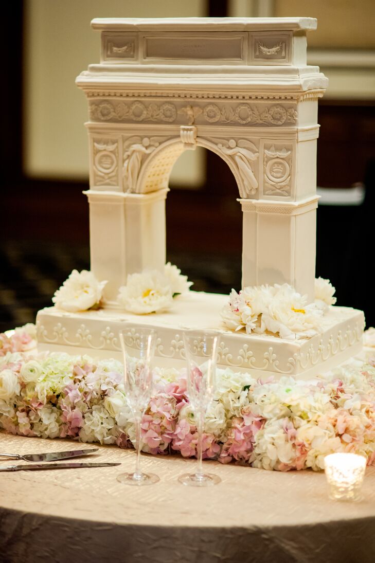 Judy at Simon Lee Bakery helped the couple design their wedding cake to look like the arch at Washington Square Park in New York City where Cole proposed to Emy. "It was so unique and personal for us. The details were amazing, and the cake tasted even better!" says Emy. There were several flavors from guests to choose from: chocolate with chocolate icing, vanilla with fresh strawberries and cream and strawberry with strawberry icing.