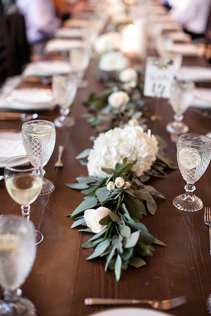 The beautiful bridesmaid bouquets were cleverly repurposed for the reception after the ceremony. Each bouquet was placed along the middle of the dining tables, and the abundance of peonies and roses created a lush feel while also keeping the floral budget in check.