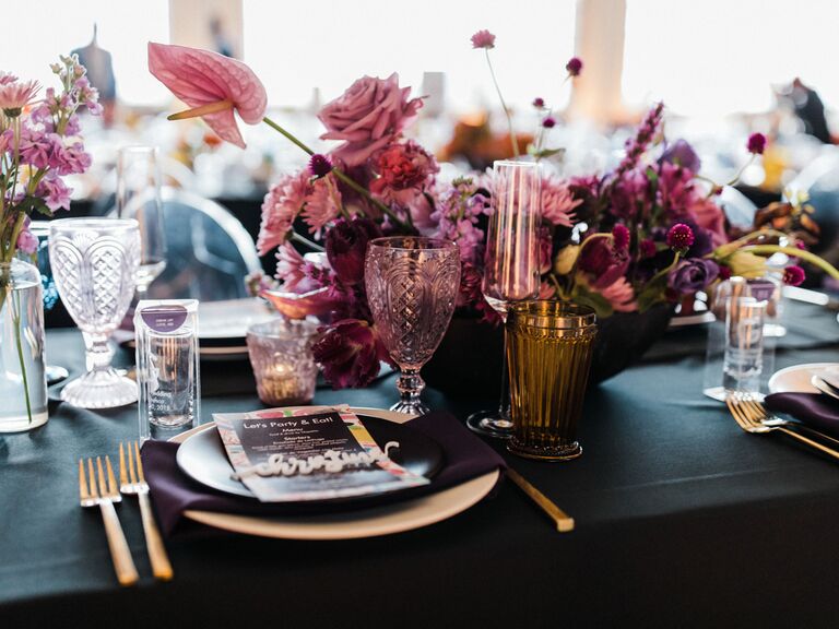 purple fall wedding centerpiece with gold accents and flatware