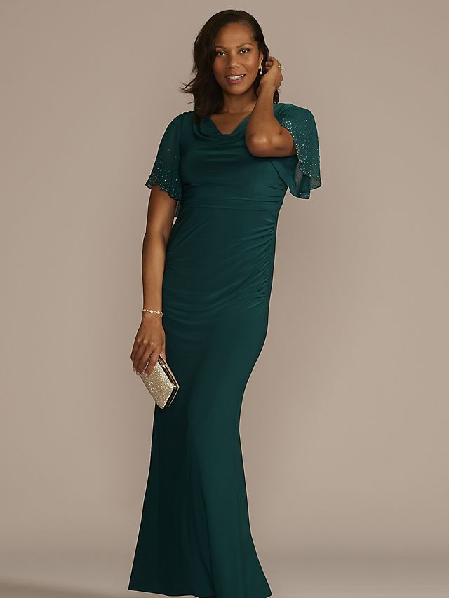A model wears this jewel-toned mother of the bride gown with floaty sleeves.