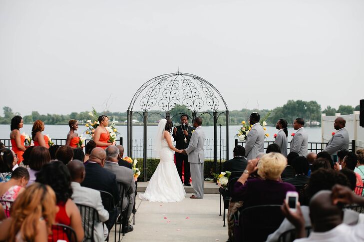 “The Roostertail captured the natural beauty of Detroit’s riverfront and allowed our guests to enjoy the warm summer breeze,” Ebony says. “The breathtaking view of the water painted a stunning backdrop for our day.” Ebony and Jeremy used two arrangements of white calla lilies and yellow roses on either side of the metal arbor to highlight their picturesque venue. Each guest took in the view from rows of black metal chairs.