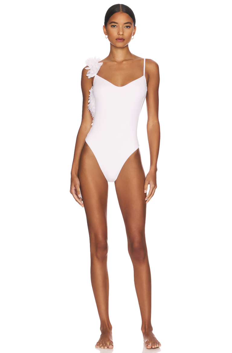 white one piece with petals on shoulder