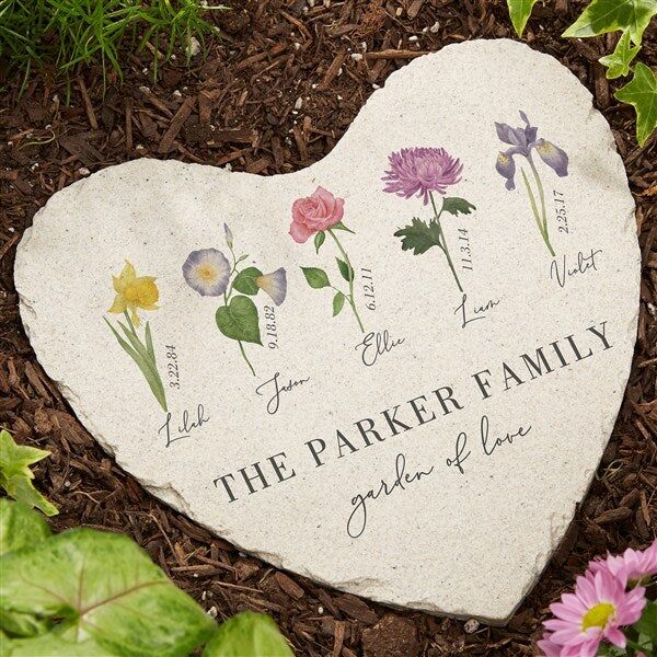 Heart-shaped garden stone featuring birth flowers, gift idea for wife. 