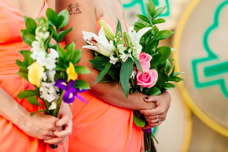 The concierge at The Cosmopolitan brought flowers from the lobby to the bridal suite the morning of the wedding, and the bridesmaids turned the one bunch of flowers into three bouquets. They used ribbons from the room-service table to tie the DIY bouquets together.