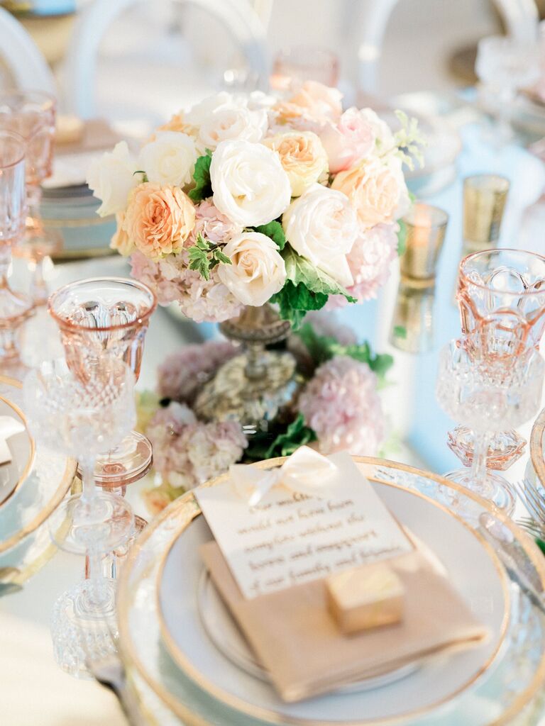 blush and ivory luxury bridal shower centerpiece with gold charger plates, tinted glassware and menu cards