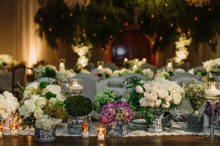 The glamorous indoor garden reception featured over 60 Chinoiserie vases of various sizes filled with an array of beautiful white flowers.