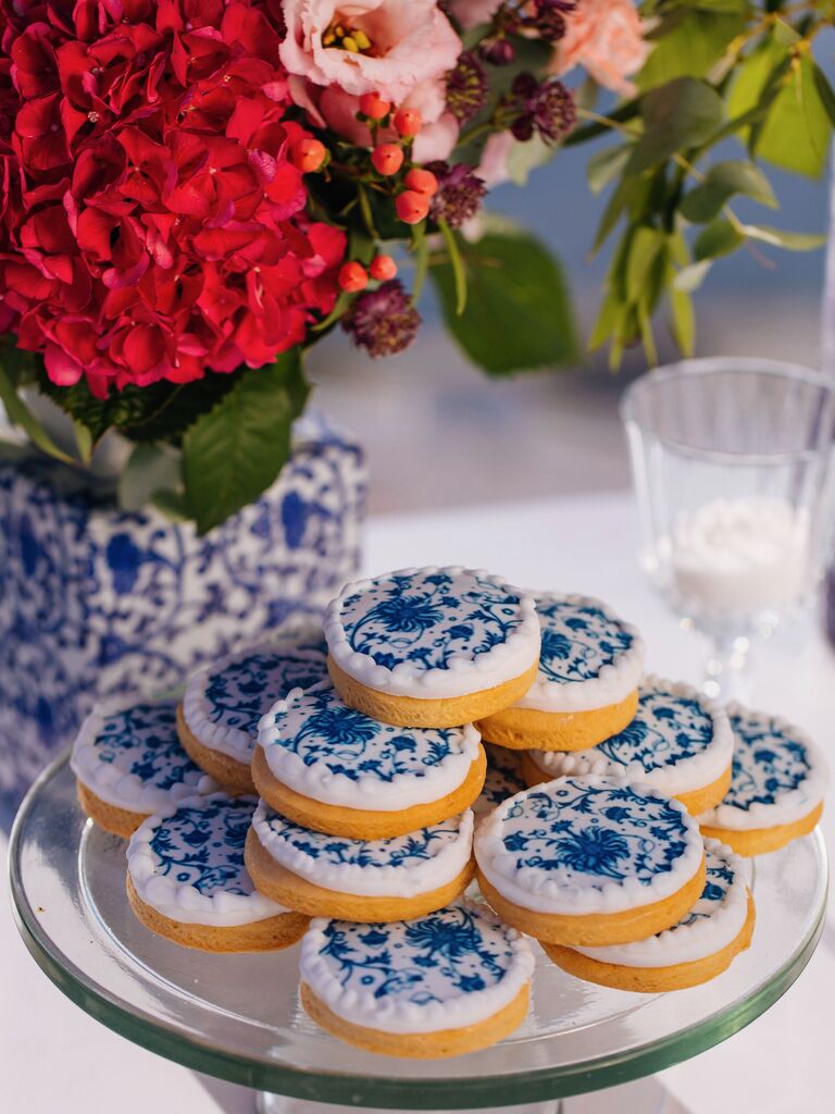 plate of sugar cookies decorated with white and blue royal icing in chinoiserie pattern