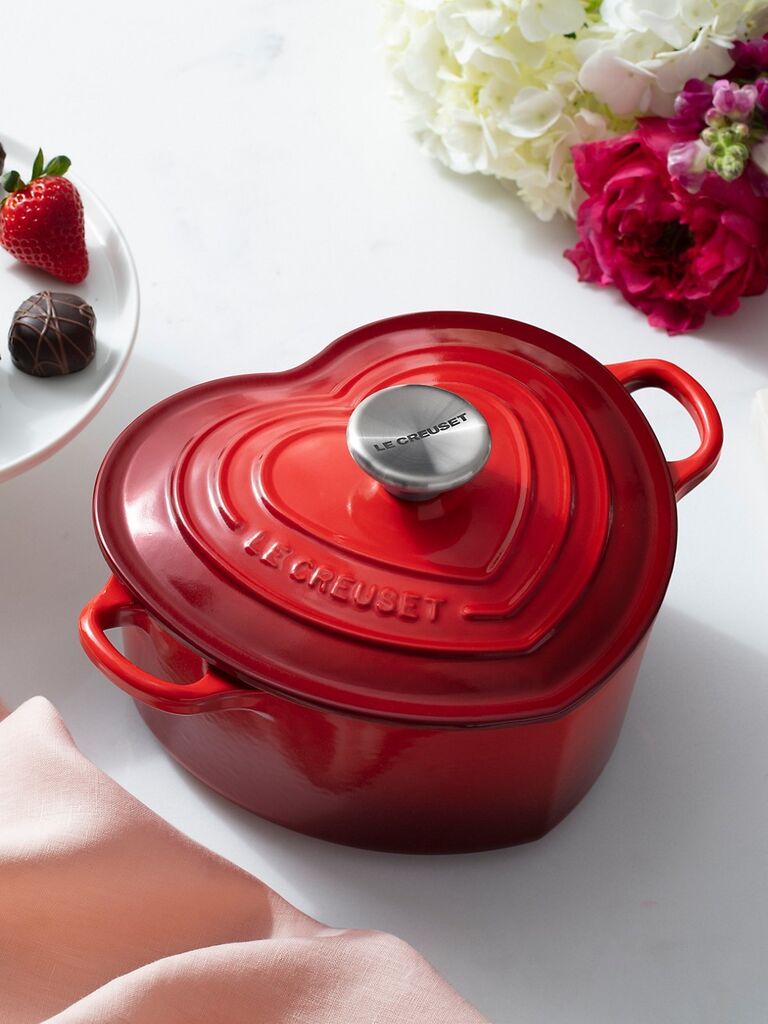 Heart=shaped dutch oven in a deep red color. 