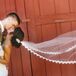 "I had always pictured myself walking down the aisle in a cathedral veil with lace trimming. After speaking with my seamstress, she told me she could make it for me as long as I provided her with the lace.  My mom, grandma and I went down to LA’s Fabric District and found the lace that perfectly matched my dress.  My veil ended up being around $100, which to me, was worth the money," says Francesca.