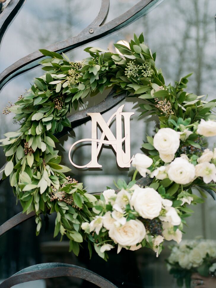 Wreaths outside the church doors featured laser-cut wooden monograms that replicated the letters on the couple’s save-the-dates, created by Ashley's father. Her mother played a role too, needlepointing a picture of the chapel on the ring bearer’s pillow.
