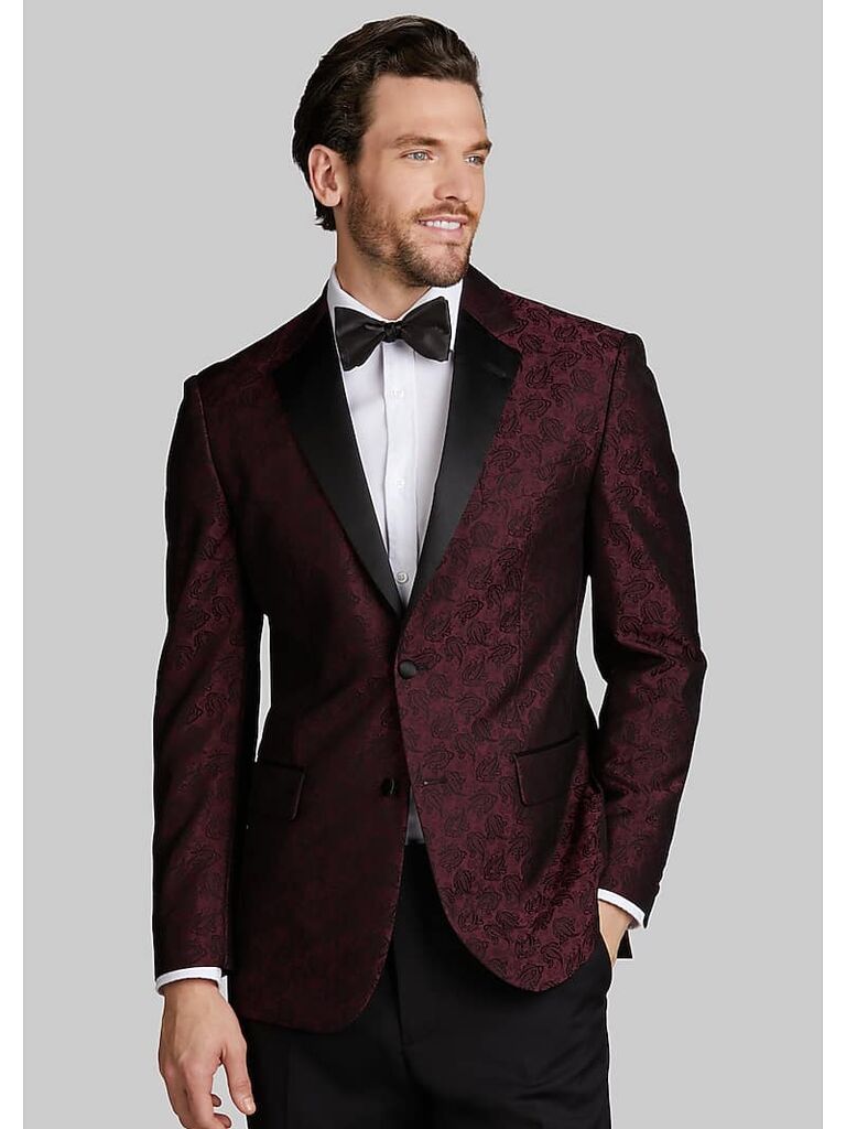 Model wears a paisley dinner coat. 