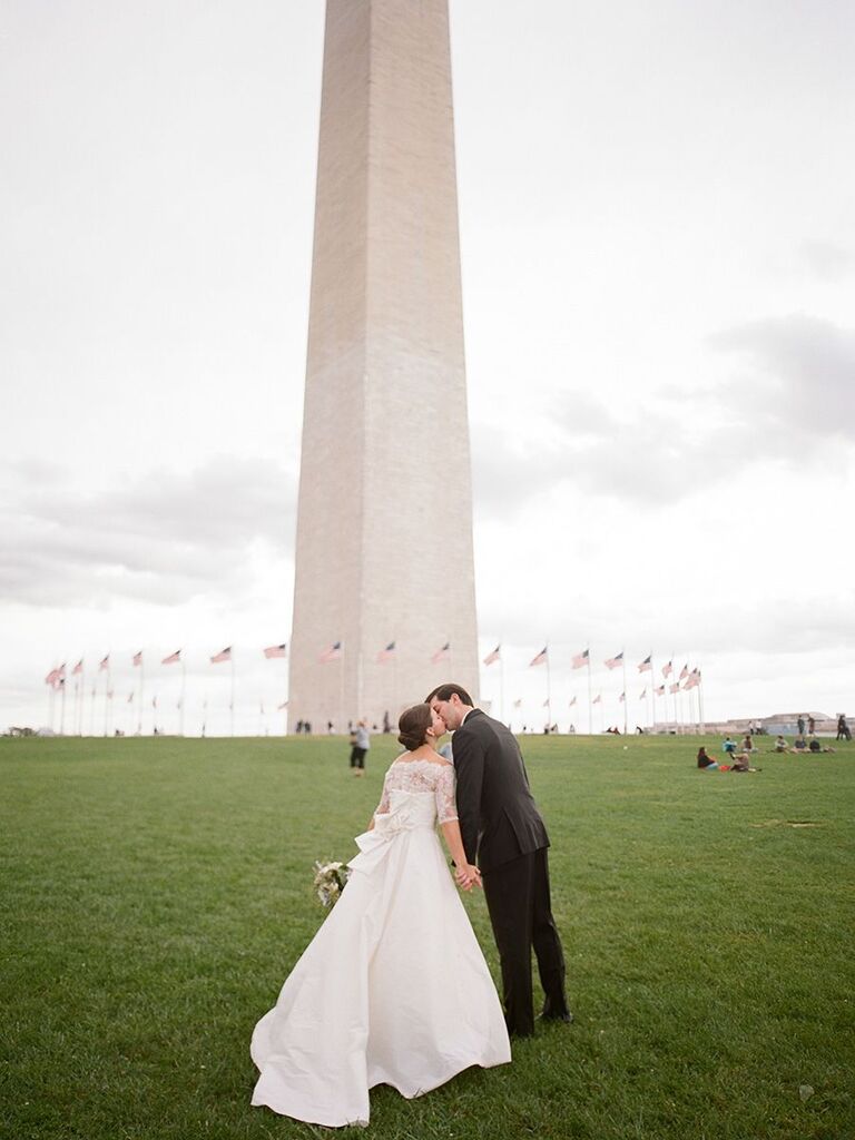 bride and groom in front of Washington monument