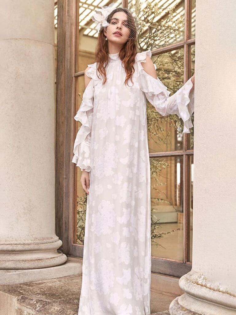 temperley london white boho wedding dress with cold shoulder sleeves halter neckline ruffle trimmed sleeves and allover lace chest and flowy skirt
