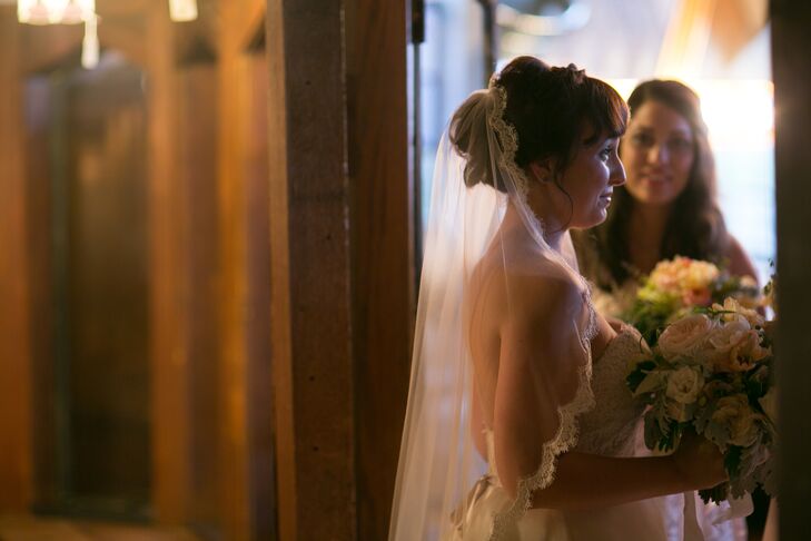 For the ceremony, Rachel added a traditional lace-edged veil to her classic low updo.