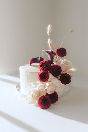 Small Cake with Burgundy Dahlias Blooms at Metropolist in Seattle, Washington