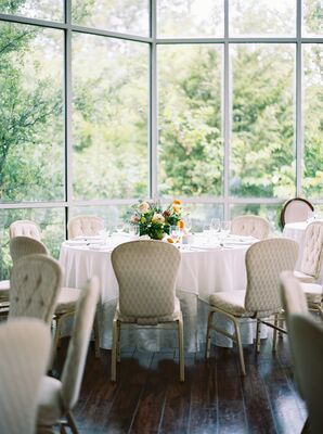 Bright, Airy Wedding Reception With White Linens and Chairs