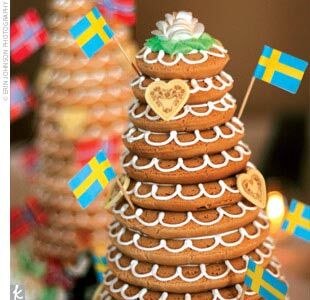 In addition to a summery strawberry shortcake, the couple served – literally -- a Swedish wedding cake to represent Nissa’s heritage and a Norwegian wedding cake to represent Gabe’s. In lieu of a receiving line, the newlyweds helped each of their guests to dessert.