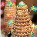 In addition to a summery strawberry shortcake, the couple served – literally -- a Swedish wedding cake to represent Nissa’s heritage and a Norwegian wedding cake to represent Gabe’s. In lieu of a receiving line, the newlyweds helped each of their guests to dessert.