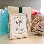 wedding gift table with sign that reads gifts and cards
