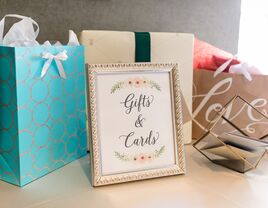 wedding gift table with sign that reads gifts and cards