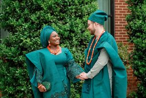 Bride and Groom in Traditional Teal Yoruba Nigerian Wedding Attire With Orange Accessories