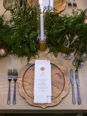 Place Setting With Wood Charger and Greenery Garland Runner