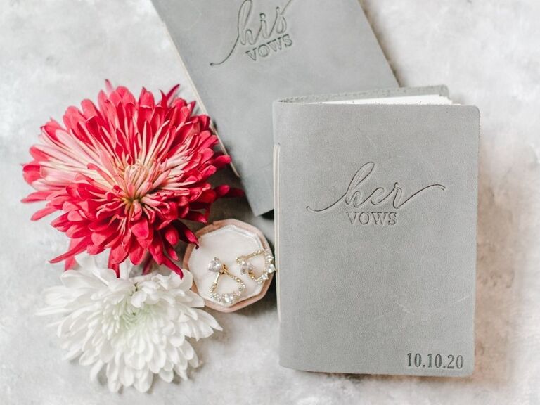 gray velvet vow books beside fresh chrysanthemum flowers