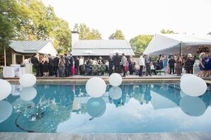 Guests at Cocktail Hour by Pool with Floating Lanterns
