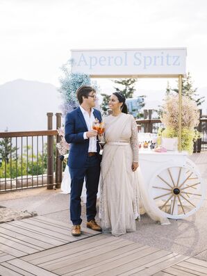 Bride and Groom Beside Aperol Spritz Cart Atop Aspen Mountain