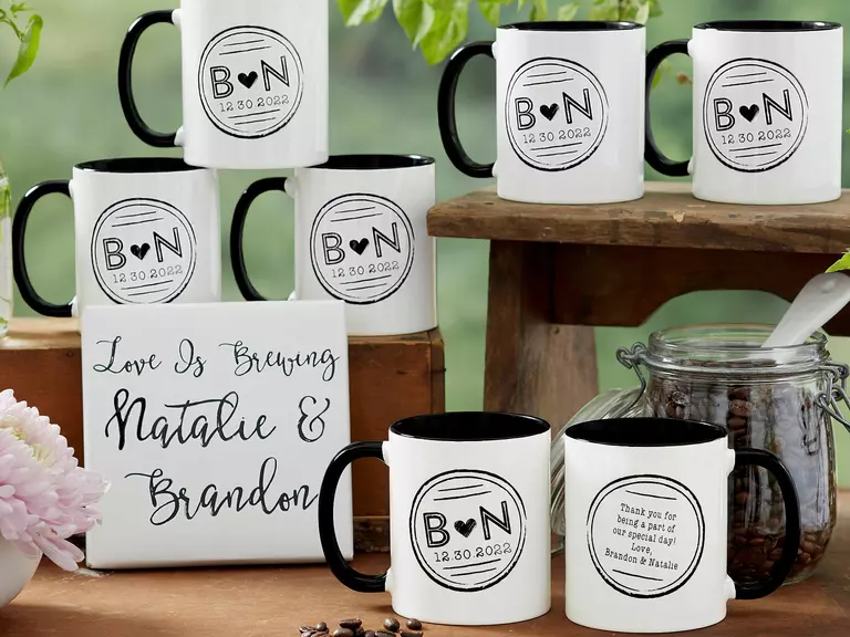 Personalized coffee mugs featuring a couples' initials. 