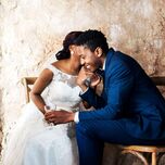 Couple having intimate moment at wedding reception before wedding night