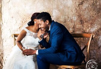 Couple having intimate moment at wedding reception before wedding night