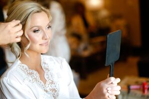Bride Holding Mirror During Hair and Makeup