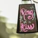 Francesca and Ricky created a hand-painted cowbell that guests and wedding party members could ring for the couple to kiss. It said, "Ring for a kiss!"