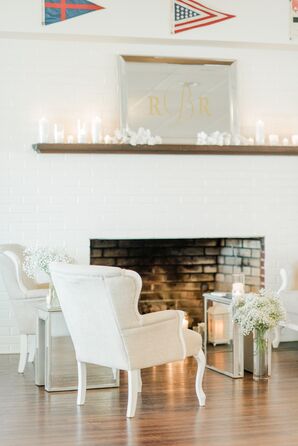 Neutral and Metallic Lounge Area with Candles and Monogrammed Mirror