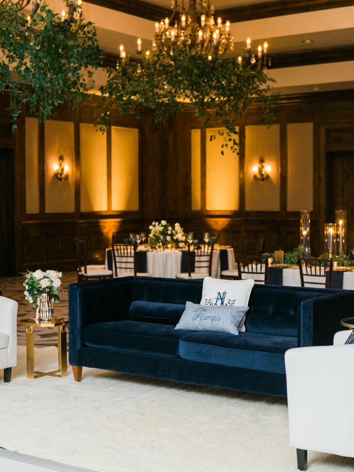 Navy velvet couches flanked the dance floor, complete with custom pillows monogrammed with the couple’s initials, wedding date and last name. The “mini lounges” around the dance floor allowed everyone to be close to the action.